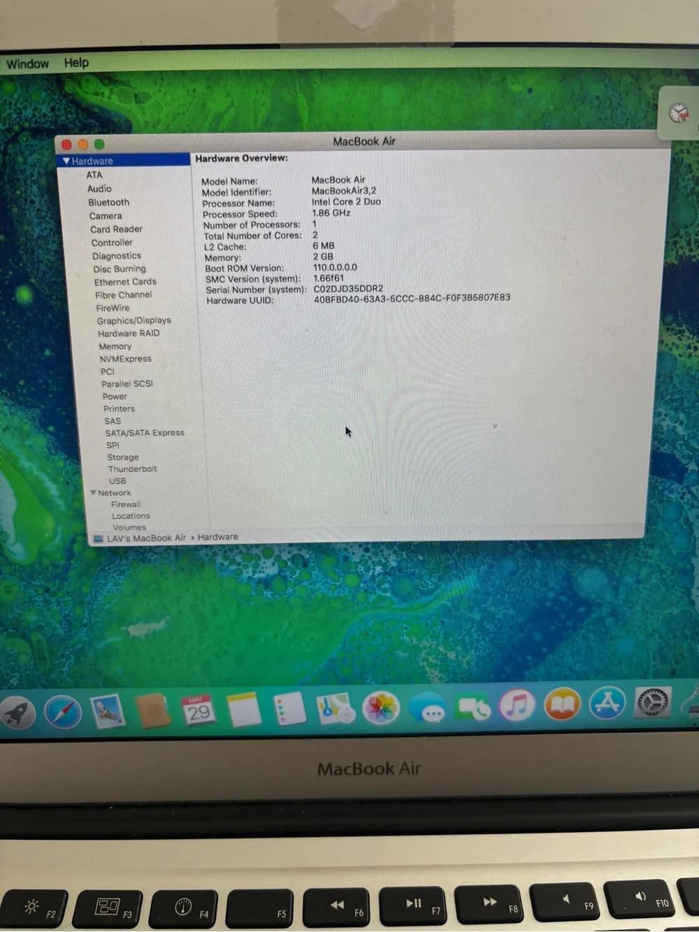 Apple Laptop in Silver with Charger Cord